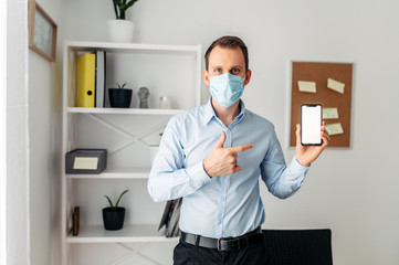 Man in a medical mask at the office