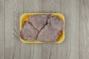 chilled chicken meat on wooden table