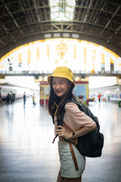 Beautiful traveller waiting for the train at the station