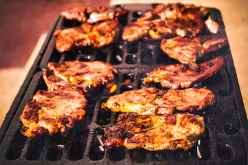 Pork steaks on the grill. Serbian barbecue.