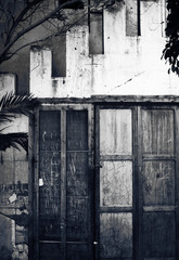 Middle Eastern style abandoned old house with traces of destruction in monochrome
