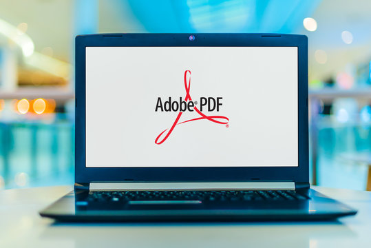 Laptop computer displaying logo of Adobe Acrobat