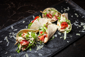 beautiful appetizer with meat and vegetables in lavash