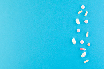 A set of hygienic antiseptics and medications on a blue background.