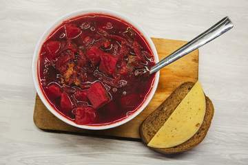 Russian home-made borsch with bread and cheese