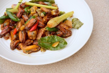Oseng Kerang Saus Tiram, Indonesian food. Stir-fried mussels with oyster sauce, soy sauce, lemongrass, bayleaf, ginger, garlic and chili.