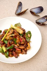 Oseng Kerang Saus Tiram, Indonesian food. Stir-fried mussels with oyster sauce, soy sauce, lemongrass, bayleaf, ginger, garlic and chili.