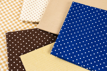 Mix of beige, white and brown cotton fabric.