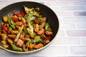 Oseng Kerang Saus Tiram, Indonesian food. Stir-fried mussels with oyster sauce, soy sauce, lemongrass, bayleaf, ginger, garlic and chili.