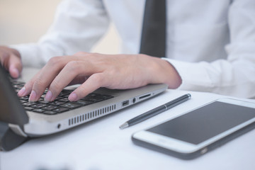 Businessman typing computer working in office