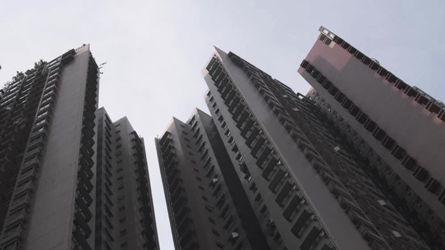 View on huge skyscrapers inside Hongkong City with view from the steet