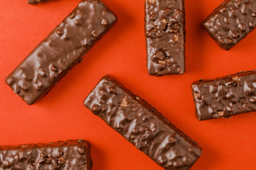 Crispy waffle sticks on a red background
