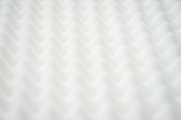White gradient abstract background with many waves at different angles.