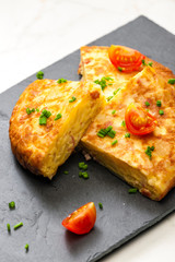 Spanish tortilla with tomatoes and chive