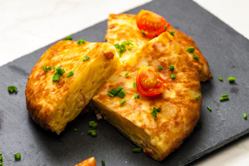 Spanish tortilla with tomatoes and chive