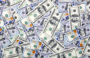  Heap of one hundred dollar bills on money