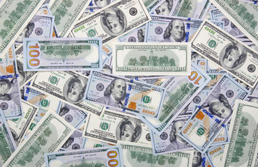  Heap of one hundred dollar bills on money