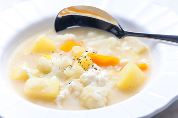 cauliflower soup with carrot, potato and egg