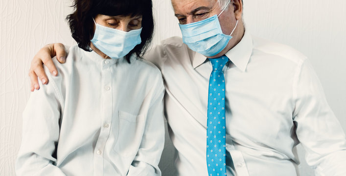 Coronavirus quarantine and Air pollution pm2.5 concept. Old sick man and woman wearing blue respirator mask for protect. Wuhan, China epidemic virus symptoms background.