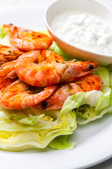 still lfe of grilled shrimps with garlic dip