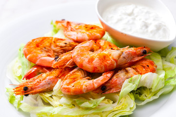 still lfe of grilled shrimps with garlic dip