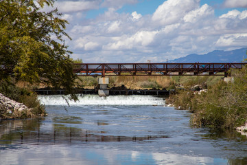 Fototapeta na wymiar A walking bridge over a small river in Las Vegas