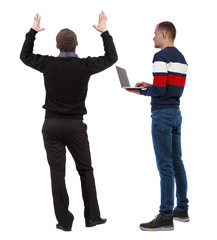 Back view two man in sweater.