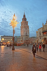 Fototapeta na wymiar Cloth Hall and Town Hall Tower in the Main Market Square of the Old City in Krakow in Poland at Christmas