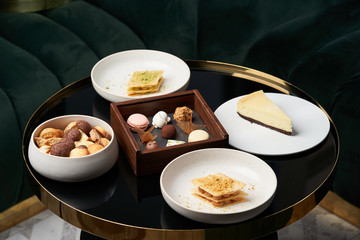  Sweet cookie snack, cake slices and chocolate candy on table, close-up