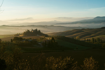 Fototapeta premium Foggy valley in the Tuscany, Val d Orcia, Italy
