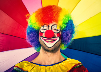 Funny clown in a colorful background