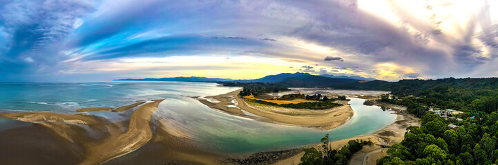 Ultra wide HDR Panorama of River estuary with mountains in the background