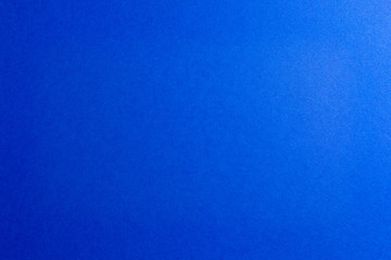 Navy blue color paper background, copy space.