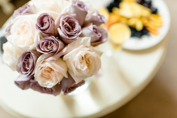 Obraz na płótnie Canvas Wedding Bridal Bouquet Purple and white roses