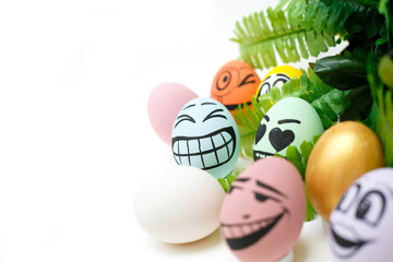 Fototapeta na wymiar Perfect colorful handmade easter eggs with green plant isolated on white background. Easter day concepts. Funny decoration. Happy Easter. Copy space for text.