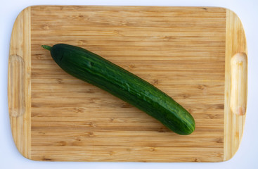 cucumber on a wooden board