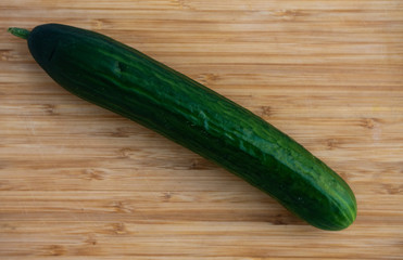 cucumber on a wooden board