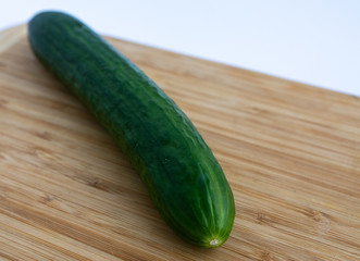 cucumber on a wooden board