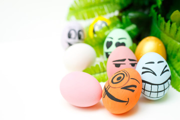 Perfect colorful handmade easter eggs with green plant isolated on white background. Easter day concepts. Funny decoration. Happy Easter. Copy space for text.