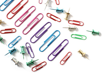 Paper clips on a white background. Stationery. Background.