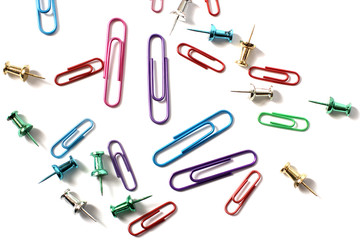 Paper clips on a white background. Stationery. Background.