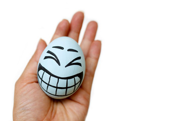 Perfect colorful handmade easter eggs with smile eggs in human hand isolated on a white background. Easter day concepts. Funny decoration. Happy Easter.