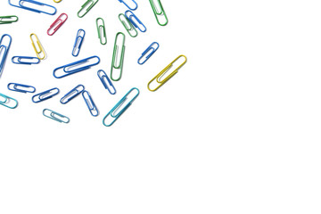 Paper clips on a white background. Stationery. Background