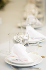 Glasses for wine and champagne on a served table at a banquet