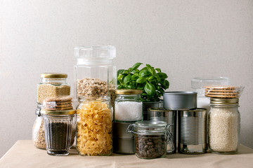 Food supplies crisis food stock for quarantine isolation period. Different glass jars with grains,...
