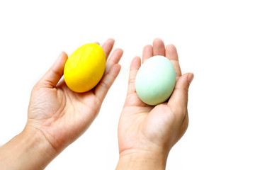 Perfect colorful handmade easter eggs in human hand isolated on a white background. Easter day concepts. Funny decoration. Happy Easter.