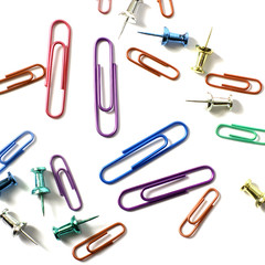 Paper clips on a white background. Stationery. Background.