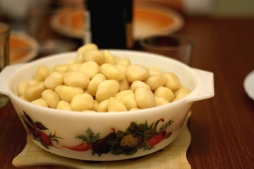 Bowl of cooked gnocchi. Selective focus.