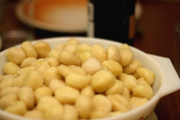 Bowl of cooked gnocchi. Selective focus.