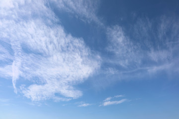 white clouds in the blue sky in summer ideal as a backdrop for m